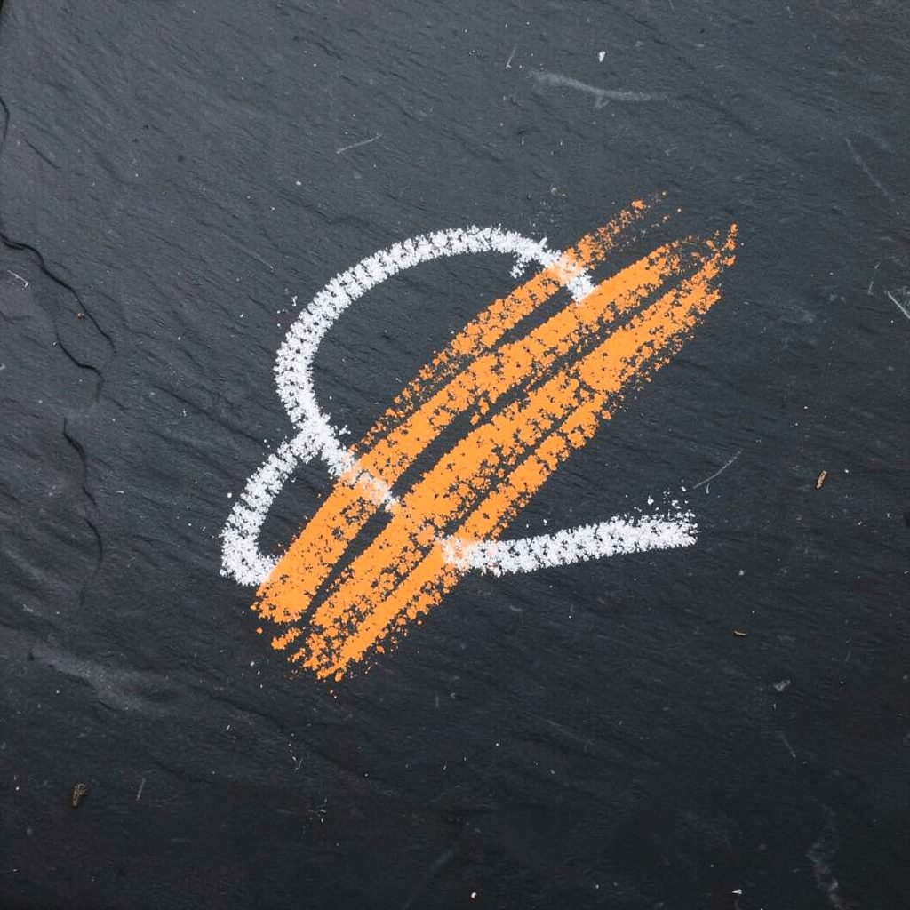 Gold emblem of Kapsel Corps on a dark background